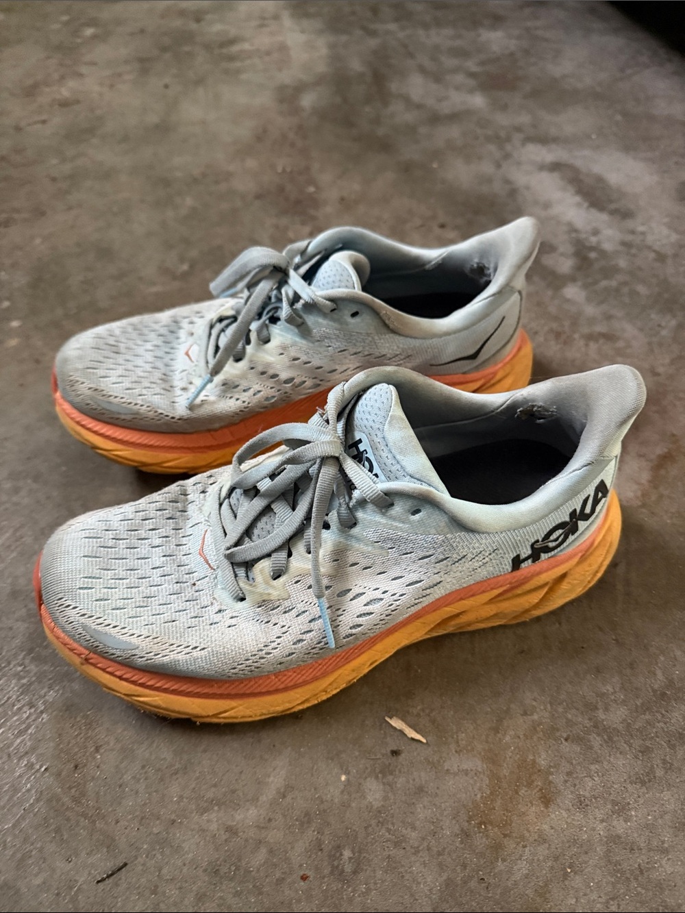 Hoka Clifton Light Blue Running Shoes with Orange Gradient Midsole